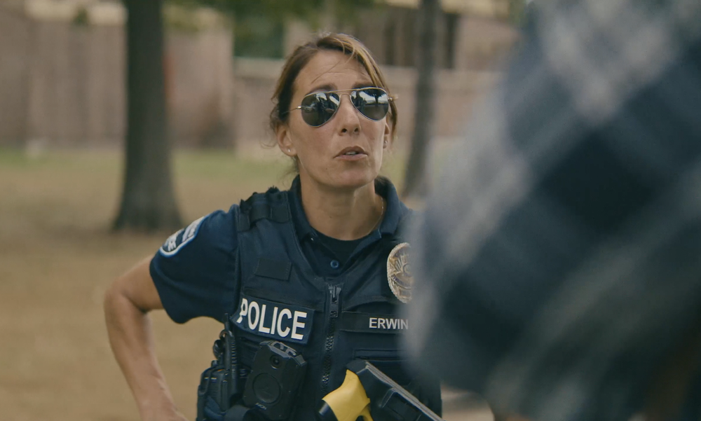 police officer talking to civilian in police recruitment video production