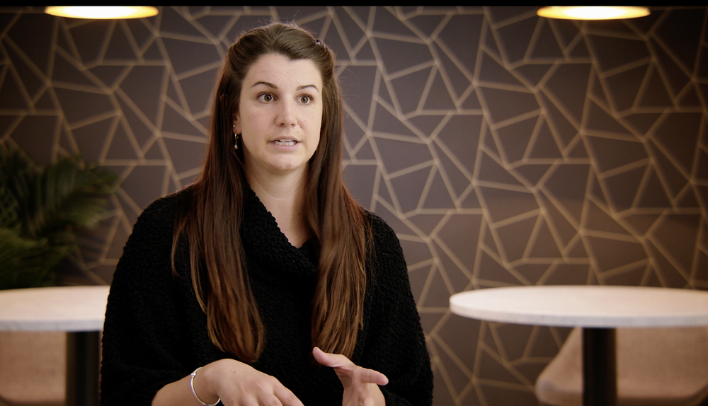 Video testimonial still frame of realtor praising her brokerage