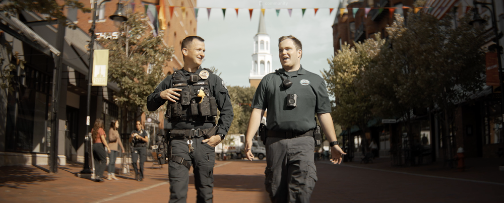 burlington police department officers walking down church street in burlington, vermont. screen shot from burlington police department's recruitment video production horizon visual media