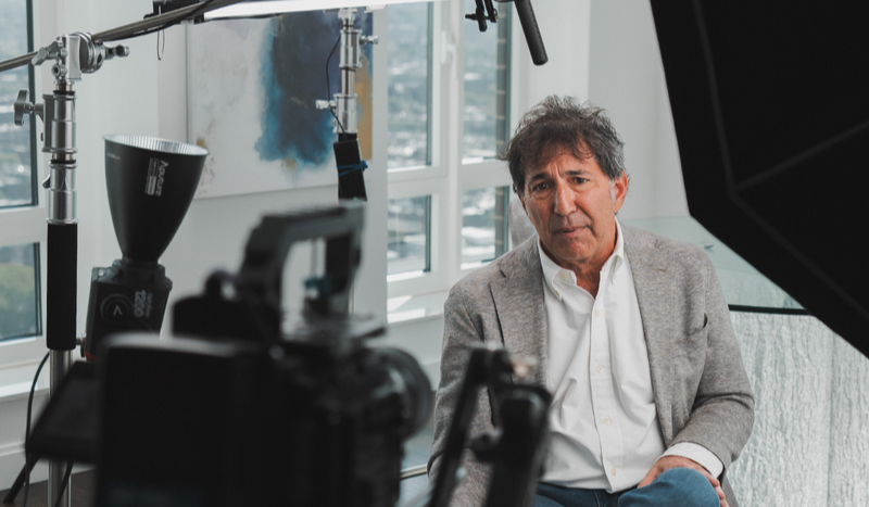 client testimonial video production behind the scenes, client talking to camera